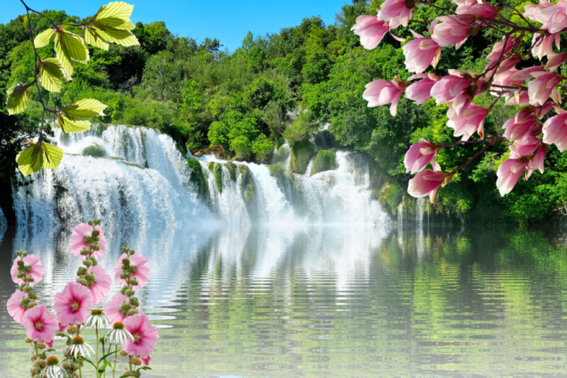 Lessons And Quotes From The Waterfall-a waterfall surrounded by trees and flowers