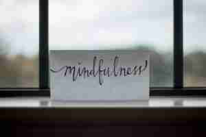 mindfulness printed paper near window