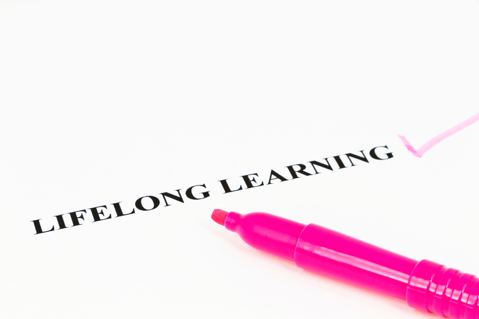 Lifelong Learning -a pink marker on a white paper