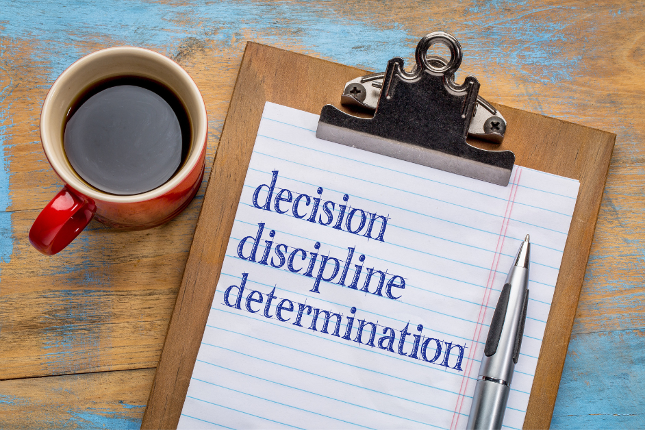 Self-Discipline -a clipboard with a pen and a cup of coffee